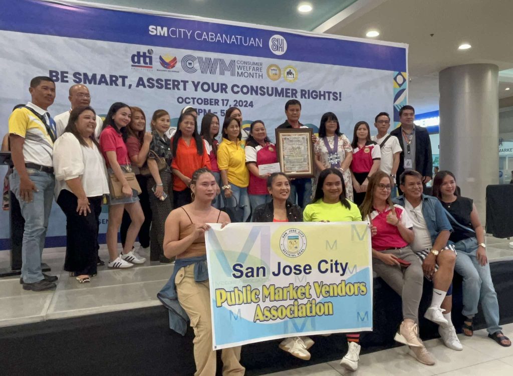 The city government of San Jose, recognized as one of the first-place winners of the 2024 Pinakamaringal na Pamilihang Bayan in Nueva Ecija alongside the municipal governments of Carranglan and Rizal, receives its award during the provincial Consumer Welfare Month celebration. (Maria Asumpta Estefanie C. Reyes/PIA 3)