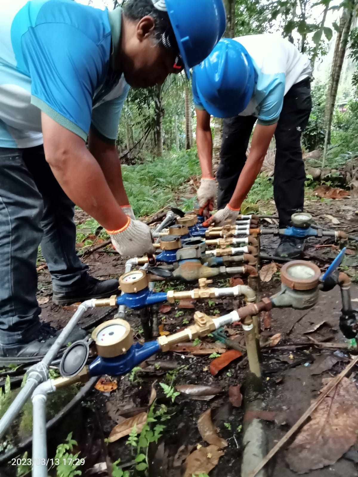 The technical team of Camiguin Water Company facilitated the meter replacement at Bura, Catarman, Camiguin. (Photo courtesy of CWC)