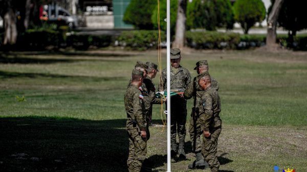 Soldiers lowered MGen Jose Maria R. Cuerpo II's personal flag, symbolizing the conclusion of his almost 39 years in military service. The personal flag was presented to Cuerpo during the Change of Command and Retirement Ceremony, January 17, Camp Edilberto Evangelista, Patag, Cagayan de Oro City. (Photo: SAYU/PIA-10)