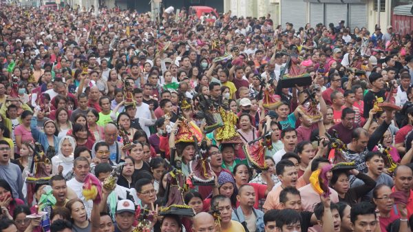 Devotees carry images of the Black Nazarene during the procession, commemorating the Traslación, or the transfer of the Black Nazarene from the St. Augustine Metropolitan Cathedral to the Jesus Nazareno Parish-Shrine of the Black Nazarene on January 9. (Photo: DCC/PIA-10)