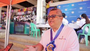 Cagayan de Oro branch Area Director Olegario J. Magahin, Jr. encourages residents of Manolo Fortich, Bukidnon, to have their unfit peso bills and coins exchanged at First Valley Bank, which serves as one of the BSP's partner currency exchange centers. (Photo: DCC/PIA-10)