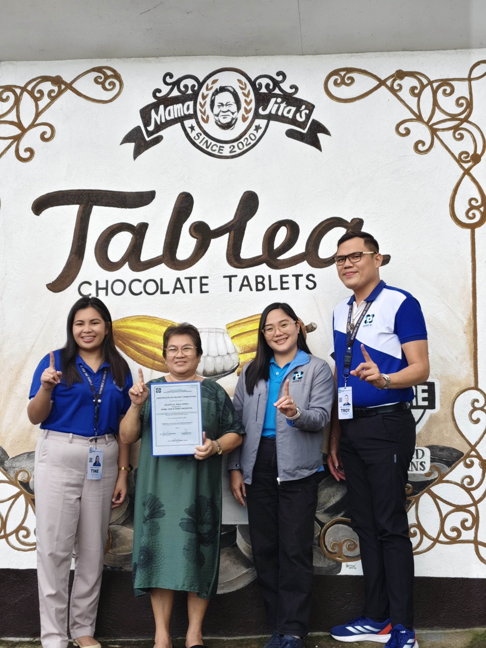 Julieta B. Dela Cerna was awarded the certificate of project completion together with DOST Camiguin Provincial Director Joanne Katherine R. Banaag and staff. (Photo courtesy of DOST Camiguin)