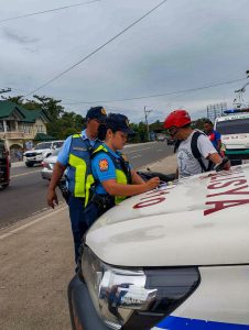 A Philippine National Police (PNP) Misamis Oriental Police Provincial Office (MISOR PPO) personnel apprehend a traffic violator at a checkpoint in El Salvador City, Misamis Oriental, February 21. Visible is a body-worn camera as means of capturing videos during police operations. According to MISOR PPO Deputy Provincial Director for Administration PLtCol Mardy M. Hortillosa, the use of this device can record interactions between officers and the public, ensuring proper procedures are followed and reducing livelihood of misconduct or abuse of power. According to Hortillosa, PNP personnel wear body cameras as means of also protecting themselves against false accusations of misconduct or use of excessive force. (Photo courtesy of El Salvador City LDRRMO)