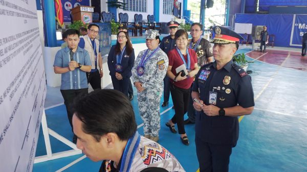 Philippine National Police (PNP) Police Regional Office (PRO)-10 Regional Director PBGen Jaysen De Guzman and other heads of national government agencies signed the ceremonial solidarity pledge wall as a sign of their commitment for an orderly, peaceful, and credible midterm elections. Civil Society Organizations present during the launching of the 100 Days Operational Activities and Solidarity Pact Signing for the 2025 National and Local Elections (NLE) and Bangsamoro Autonomous Region in Muslim Mindanao Parliamentary Elections (BARMM PE) also signed the pledge, February 5, Camp 1Lt Vicente G. Alagar, Lapasan, Cagayan de Oro City. (Photo: DCC/PIA-10)