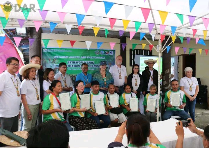 Legally owned. Seven ARBs hold the e-titles with a smile on their face, they are ready to face whatever tomorrow brings without fear of losing their land. (Photo: DAR Sorsogon)