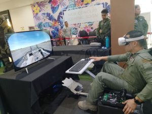 Mall-goers are immersed in a virtual flight training experience using a desktop simulator of an aircraft. (Photo: PIA Leyte)