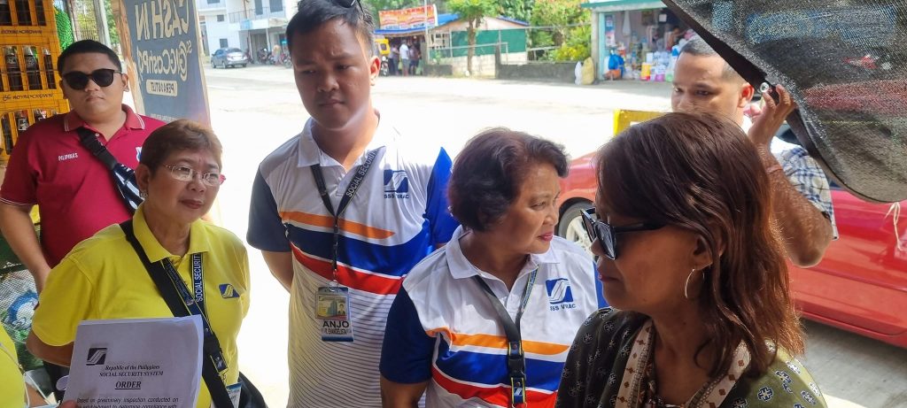 The Social Security System is intensifying its campaign through the Run After Contribution Evaders (RACE) initiative to encourage noncompliant employers to pay their overdue contributions. In this PIA file photo, a RACE team serves a violation notice to a business establishment in Virac, Catanduanes in August 2023. (PIA5/Catanduanes)