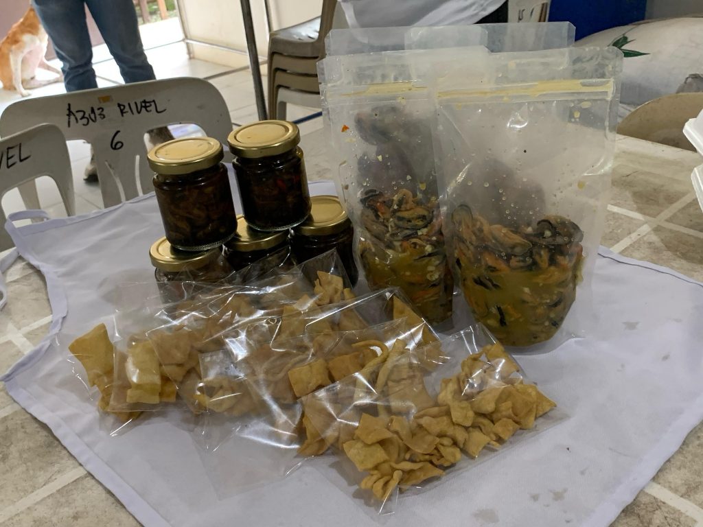 The finished products. Tahong Crunches or Chips, Bottled Tahong (Adobo Style), and Tocinong Tahong, were among the new delicacies learned by the residents of Pamurayan during the training food processing conducted by Bureau of Fisheries and Aquatic Resources and Department of Trade and Industry. The training is part of the preparation of Brgy. Pamurayan for their upcoming Tahong Festival on May 18-29, 2025. (Photo: James Bagalay, PIA 5/Sorsogon)